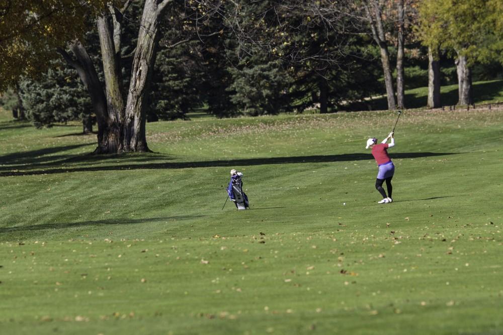 GVL / Sara Carte
Grand Valley Girl’s Golf player, Samantha Moss, swings on the ninth hole during the Davenport Invitational at Blythefield Country Club on Oct. 26.