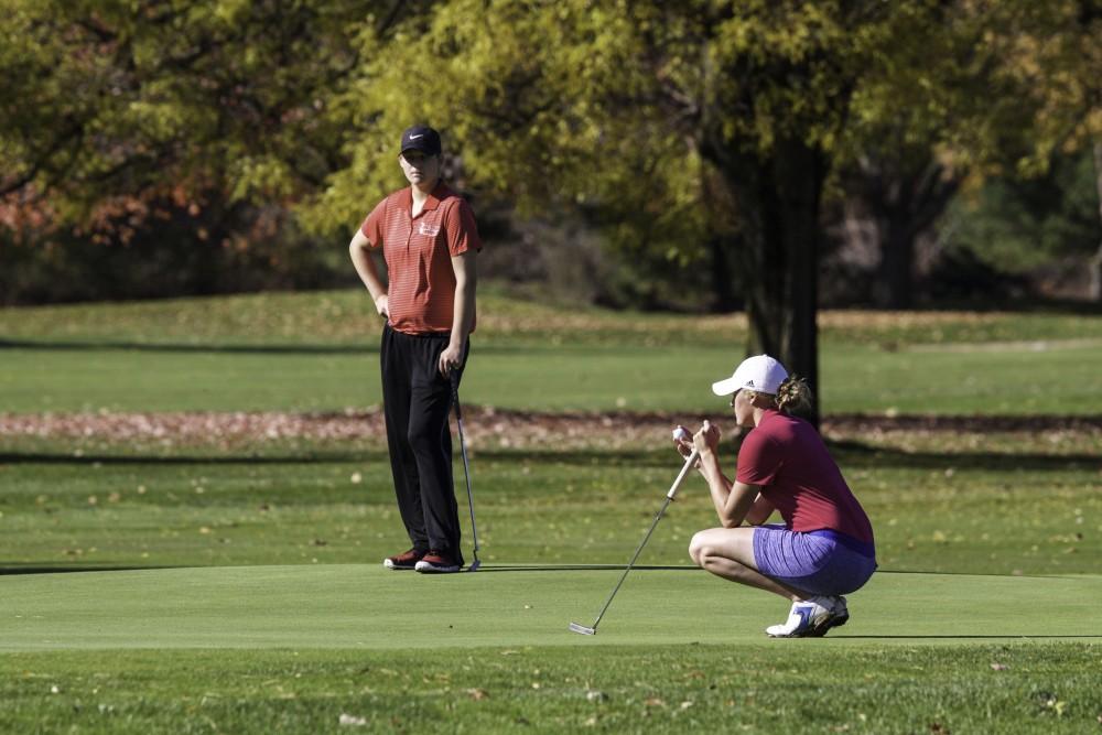 GVL / Sara Carte
Grand Valley Girl’s Golf player, Alexandra Amos, lines up her put during the Davenport Invitational at Blythefield Country Club on Oct. 26.