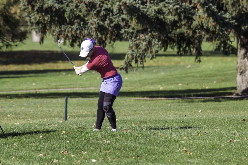 GVL / Sara Carte
GRand Valley Girl’s Golf player, Samantha Moss, chips the ball on to the green during the Davenport Invitational at Blythefield Country Club on Oct. 26.