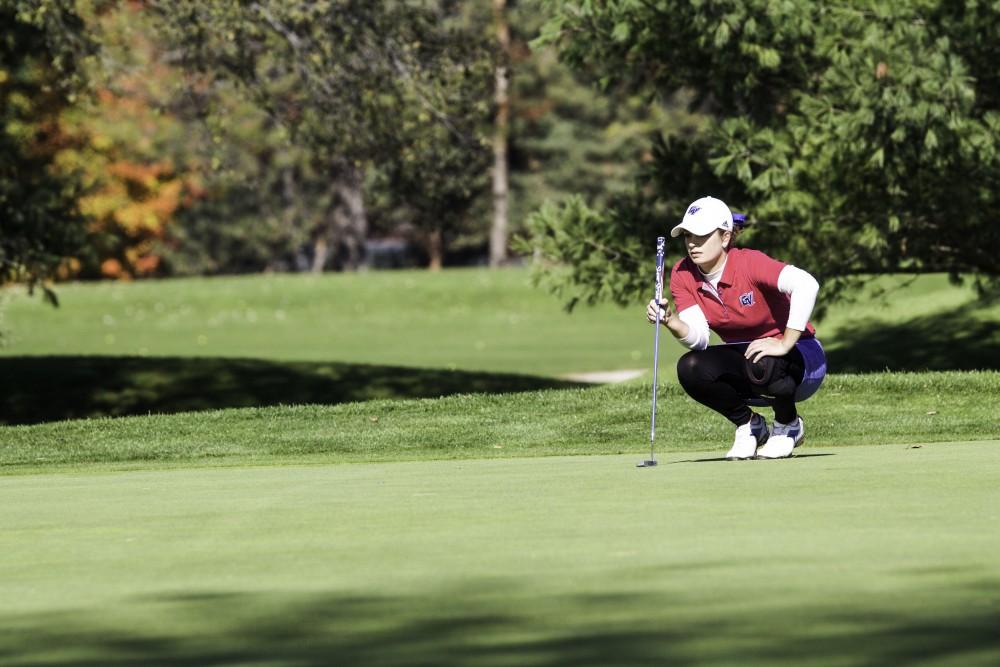 GVL / Sara Carte
Grand Valley Girl’s Golf player, Samantha Moss, lines up her put during the Davenport Invitational at the Blythefield Country Club on Oct. 26.