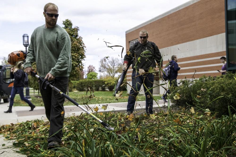 GVL / Sara Carte
Studnet grounds workers, Anthony Neumayr (left) and Caleb Hughes (right), work maintenance next to Henry Hall on Oct. 14.