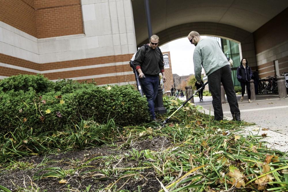 GVL / Sara Carte
Student grounds workers, Caleb Hughes (left) and Anthony Neumayr (right), works maintenance next to Henry Hall on Oct. 14.