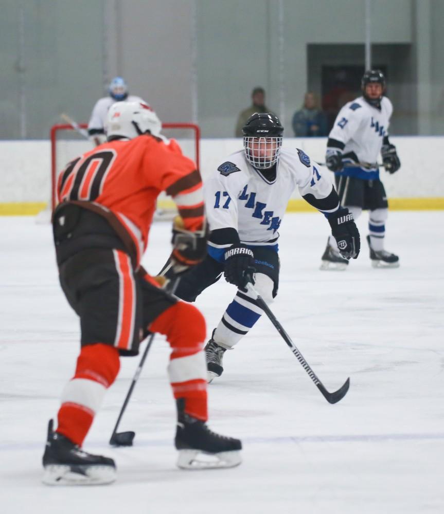 GVL / Kevin Sielaff - Austin Koleski (17) moves in for a poke check. Grand Valley's Divison II men's hockey squad squares off against Bowling Green University Oct. 16 at Georgetown Ice Arena.