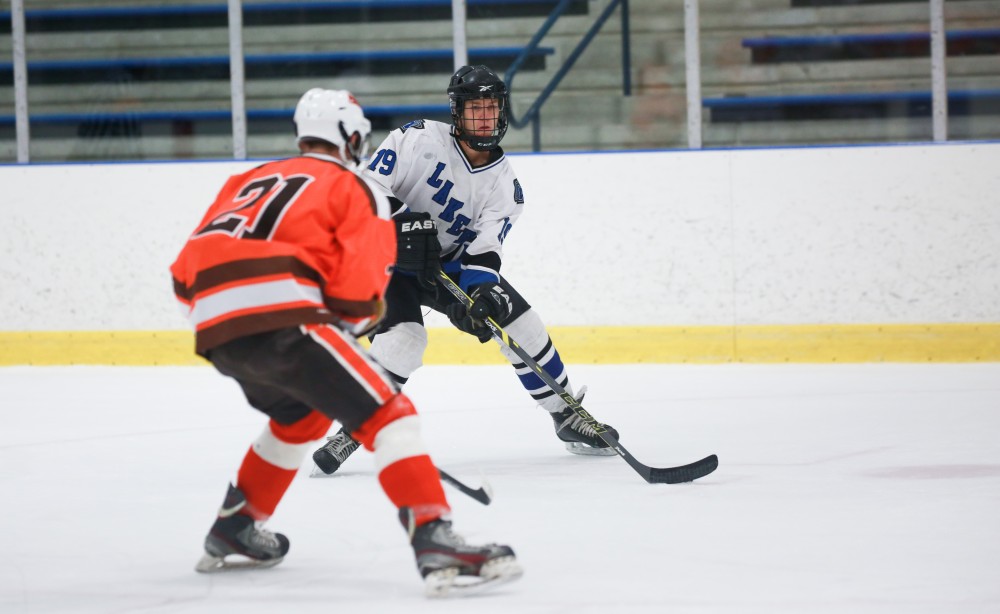 GVL / Kevin Sielaff - Collin Finkhouse (19) lines up a pass. Grand Valley's Divison II men's hockey squad squares off against Bowling Green University Oct. 16 at Georgetown Ice Arena.