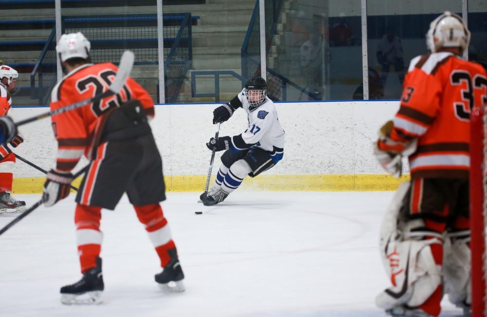 GVL / Kevin Sielaff - Austin Koleski (17) skates toward the net. Grand Valley's Divison II men's hockey squad squares off against Bowling Green University Oct. 16 at Georgetown Ice Arena.