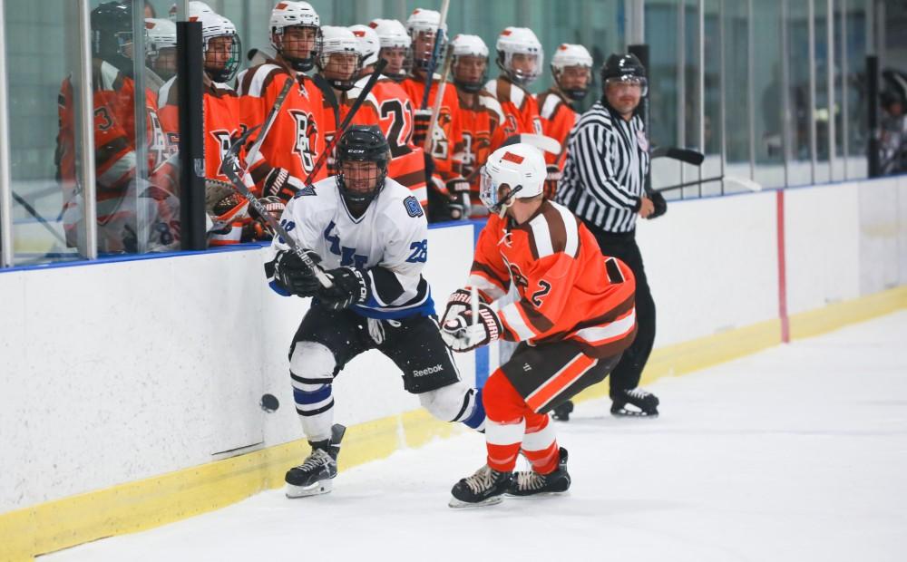 GVL / Kevin Sielaff - Lucas Little (28) looks to smack the puck back down to the ice. Grand Valley's Divison II men's hockey squad squares off against Bowling Green University Oct. 16 at Georgetown Ice Arena.