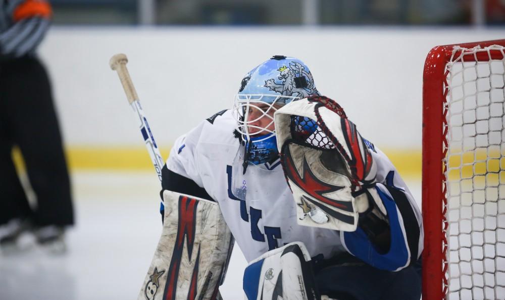 GVL / Kevin Sielaff - Goaltender Jiri Aberle (1) raises his glove in preparation for a Falcon shot. Grand Valley's Divison II men's hockey squad squares off against Bowling Green University Oct. 16 at Georgetown Ice Arena.