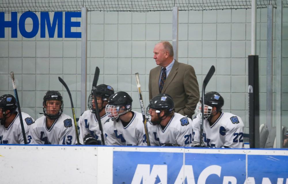 GVL / Kevin Sielaff - Head coach Mike Forbes patrols the bench. Grand Valley's Divison II men's hockey squad squares off against Bowling Green University Oct. 16 at Georgetown Ice Arena.