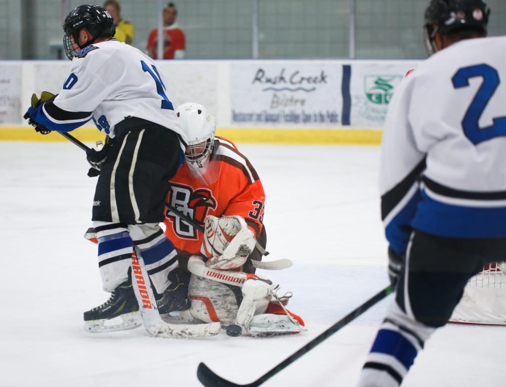 GVL / Kevin Sielaff -  Bowling Green's Jacob Butler (33) loses the puck. Grand Valley's Divison II men's hockey squad squares off against Bowling Green University Oct. 16 at Georgetown Ice Arena.