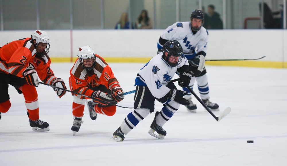 GVL / Kevin Sielaff - Mitch Claggett (10) races down the ice and scores a goal. Grand Valley's Divison II men's hockey squad squares off against Bowling Green University Oct. 16 at Georgetown Ice Arena.