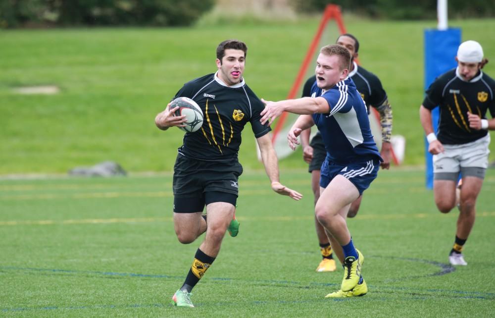 GVL / Kevin Sielaff - Grand Valley's club rugby team defeats Oakland University Oct. 3 in Allendale.