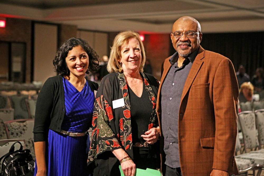 GVL / Emily Frye      
Acclaimed poets Aimee Nezhukumatathil and Kwame Dawes, along side writing department chair Patricia Clark, stop for a photo after the evenings event on Oct. 15th.