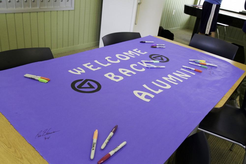 GVL / Sara Carte
Grand Valley Alumni sign a banner at the Ravine Apartments Community Center to say farewell to the Ravine Apartments for their final year of housing on Oct. 24. 