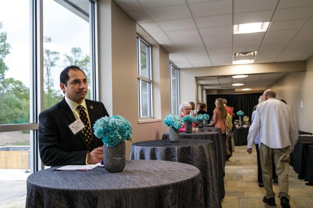 GVL / Sara Carte
Western Michigan Assistant Director, Erasmo Salinas, waits to talk to people at the open house of the Calvin Rehabilitation Center on Sept. 29.