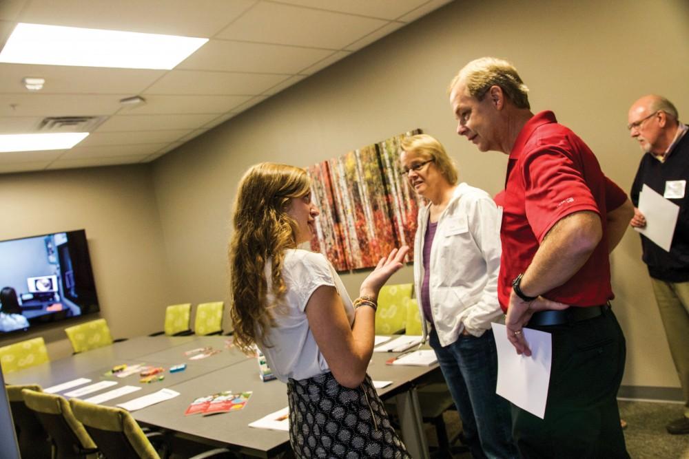 GVL / Sara Carte
Calvin social work student, Brianna Andrew, informs people of Calvin’s Rehabilitation Center on Sept. 29.