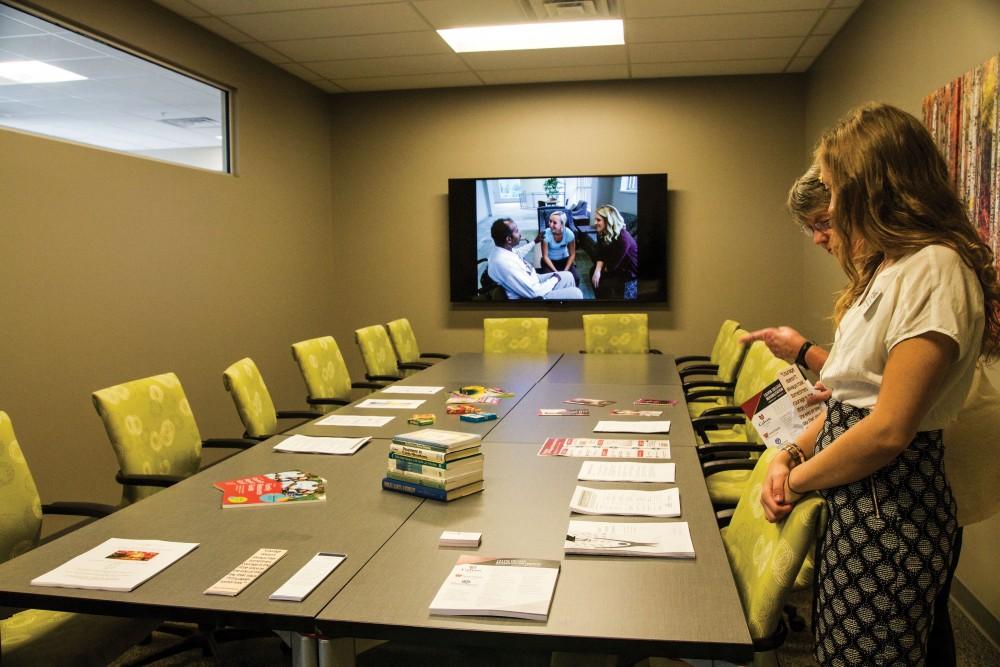 GVL / Sara Carte
Calvin social work student, Brianna Andrew, informs people of the new Rehabilitation Center on Sept. 29.