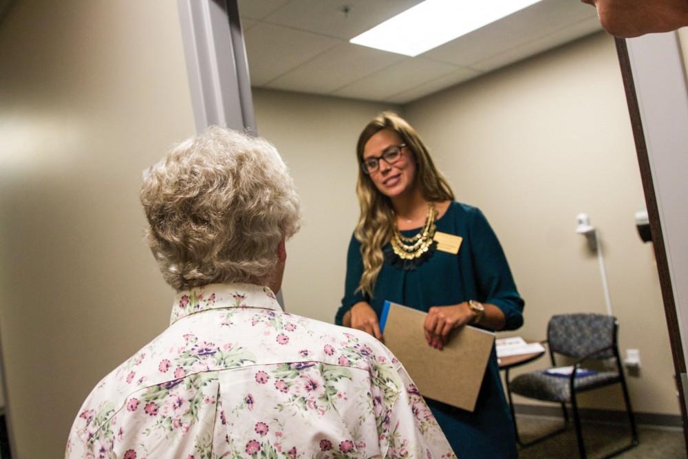 GVL / Sara Carte
Calvin graduate student, Makenzie Kuipprs, talk to people about speech pathology at the new Rehabilitation Center on Sept. 29.