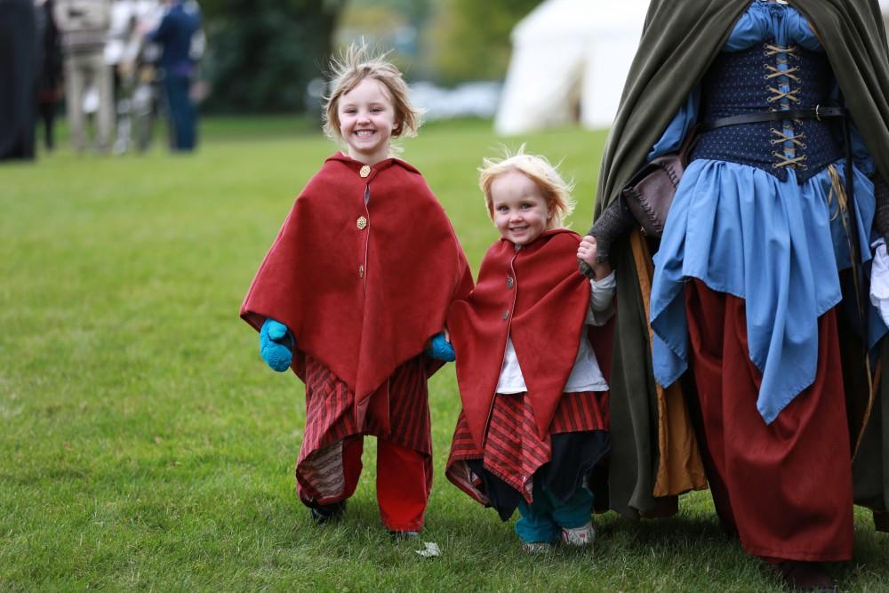 GVL / Kevin Sielaff      
Jocelyn, 2, and Abigail Lecronier, 4, enjoy the festivities. The annual Renaissance fair takes place Oct. 3-4 outside of the Kirkhoff Center in Allendale. 