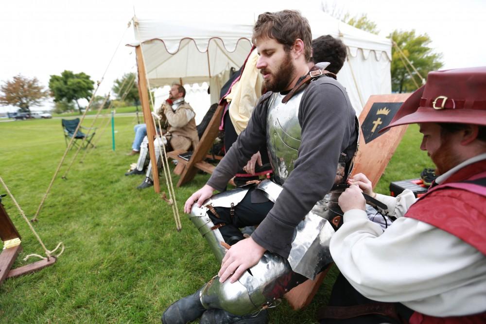 GVL / Kevin Sielaff 
Lord Malcoy Mathias has his armor removed after a fight. The annual Renaissance fair takes place Oct. 3-4 outside of the Kirkhoff Center in Allendale. 