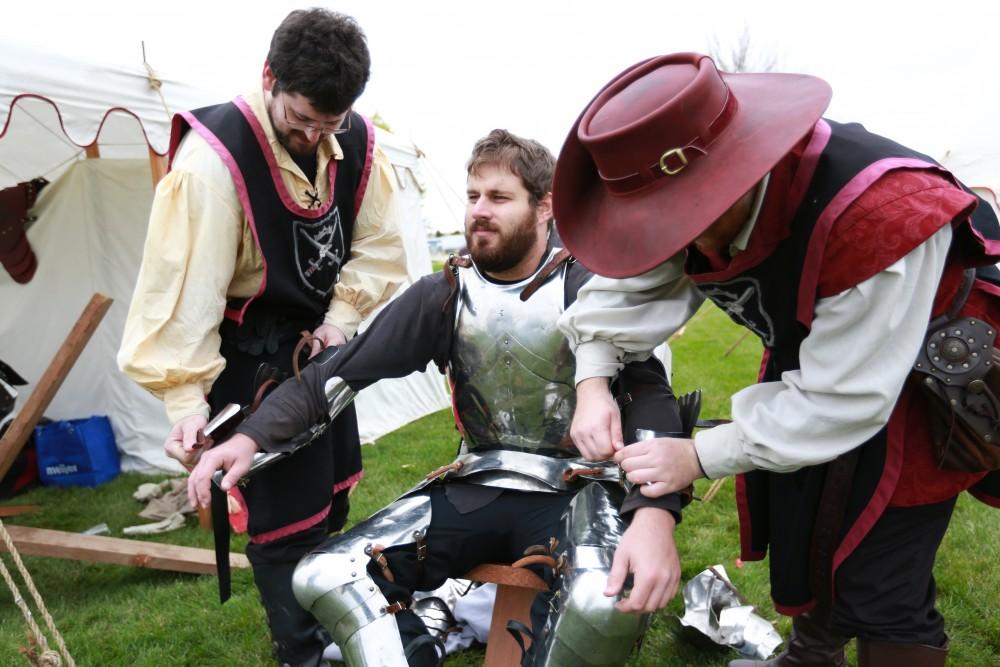 GVL / Kevin Sielaff 
Lord Malcoy Mathias has his armor removed after a fight. The annual Renaissance fair takes place Oct. 3-4 outside of the Kirkhoff Center in Allendale. 