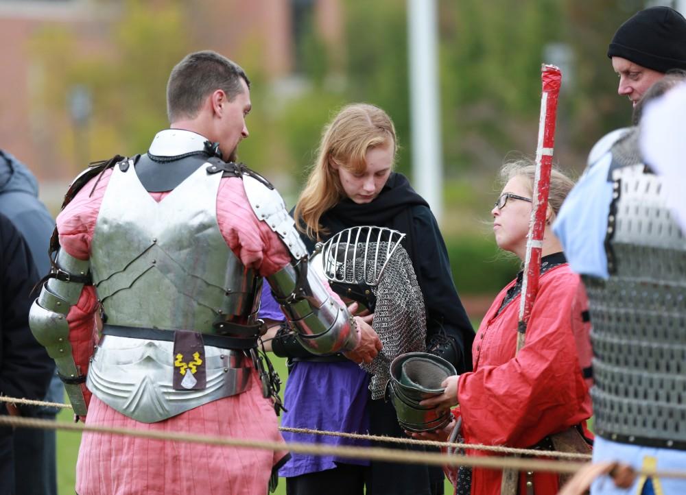 GVL / Kevin Sielaff 
Matt kruchowski shows his armor to spectators. The annual Renaissance fair takes place Oct. 3-4 outside of the Kirkhoff Center in Allendale. 