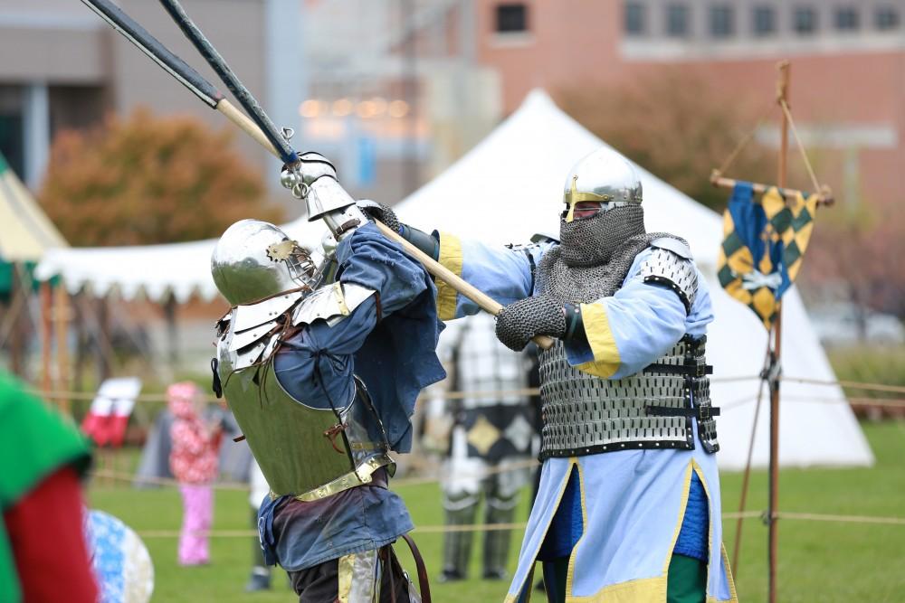 GVL / Kevin Sielaff    
John Brennan and Dan Peacock spar during the Renaissance festival. The annual Renaissance fair takes place Oct. 3-4 outside of the Kirkhoff Center in Allendale. 