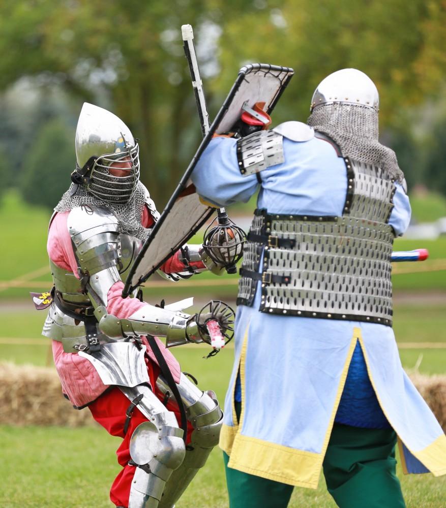 GVL / Kevin Sielaff    
Matt Kruchowski and Dan Peacock battle during the Renaissance fair. The annual Renaissance fair takes place Oct. 3-4 outside of the Kirkhoff Center in Allendale. 