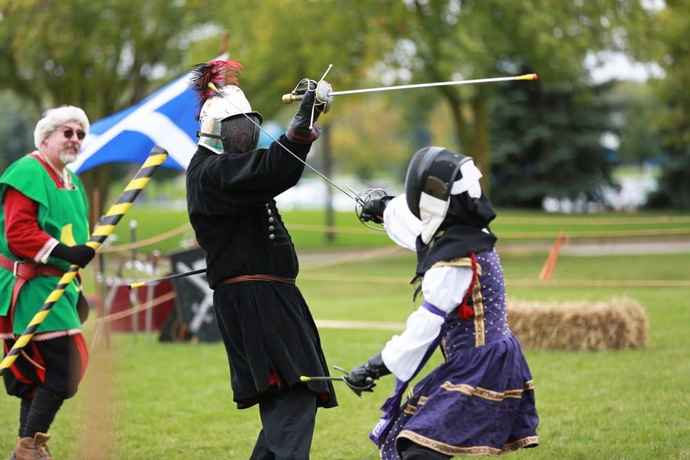 GVL / Kevin Sielaff      
Randi Jacobs and Paul Phillips fence during the Renaissance festival. The annual Renaissance fair takes place Oct. 3-4 outside of the Kirkhoff Center in Allendale. 