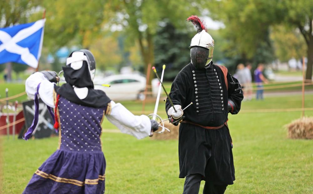 GVL / Kevin Sielaff      
Randi Jacobs and Paul Phillips fence during the Renaissance festival. The annual Renaissance fair takes place Oct. 3-4 outside of the Kirkhoff Center in Allendale. 