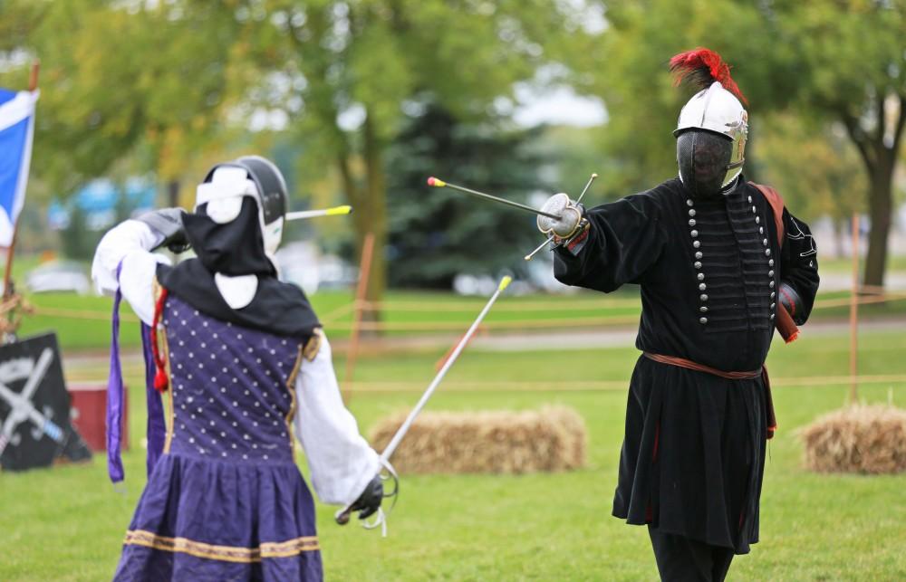 GVL / Kevin Sielaff      
Randi Jacobs and Paul Phillips fence during the Renaissance festival. The annual Renaissance fair takes place Oct. 3-4 outside of the Kirkhoff Center in Allendale. 