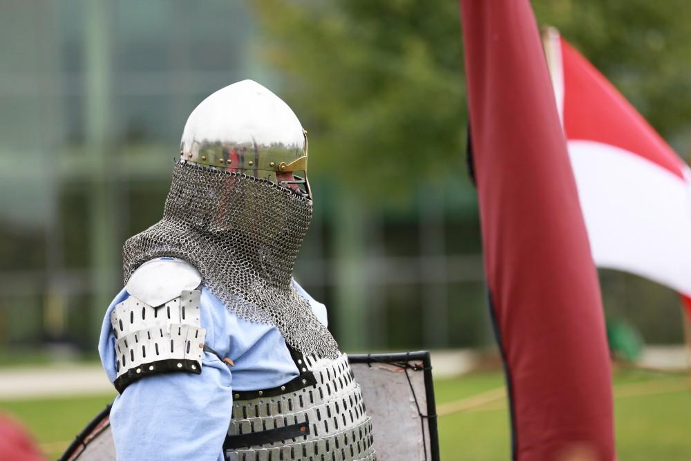 GVL / Kevin Sielaff      
Dan Peacock watches a fencing battle during the Renaissance festival. The annual Renaissance fair takes place Oct. 3-4 outside of the Kirkhoff Center in Allendale. 