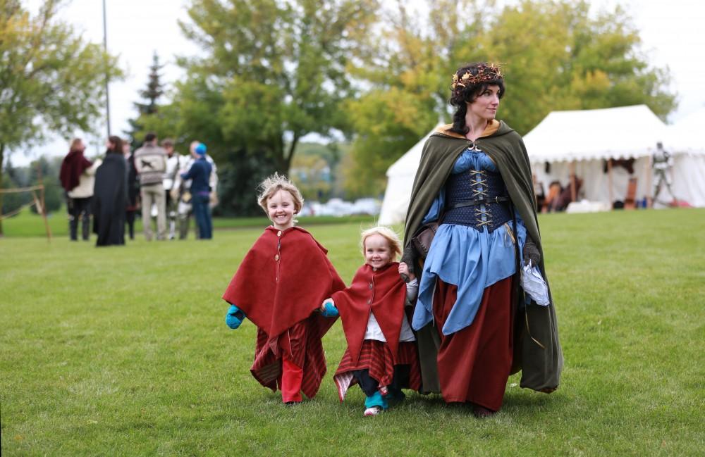 GVL / Kevin Sielaff      
Jocelyn, 2, and Abigail Lecronier, 4, enjoy the festivities with their mother Shannon Lecronier. The annual Renaissance fair takes place Oct. 3-4 outside of the Kirkhoff Center in Allendale. 