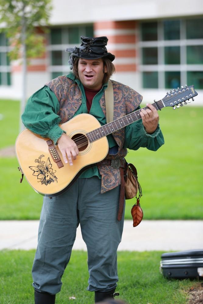 GVL / Kevin Sielaff      
Robyn the Bard plays his guitar in front of those gathered at the Renaissance festival. The annual Renaissance fair takes place Oct. 3-4 outside of the Kirkhoff Center in Allendale. 