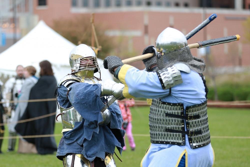 GVL / Kevin Sielaff    
John Brennan and Dan Peacock spar during the Renaissance festival. The annual Renaissance fair takes place Oct. 3-4 outside of the Kirkhoff Center in Allendale.