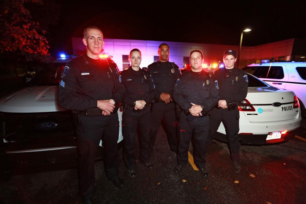 GVL / Kevin Sielaff - The Saturday night patrol unit poses for a photo outside of the Grand Valley police station on Oct. 25. 