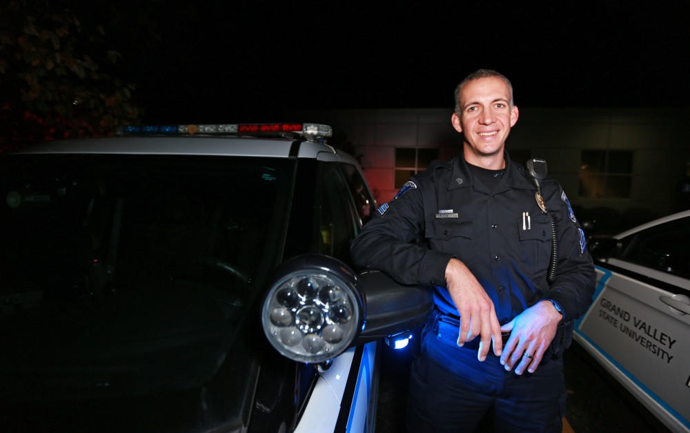 GVL / Kevin Sielaff - Sgt. Jeff Stoll wraps up the night shift and poses in front of his patrol vehicle on Oct. 25.