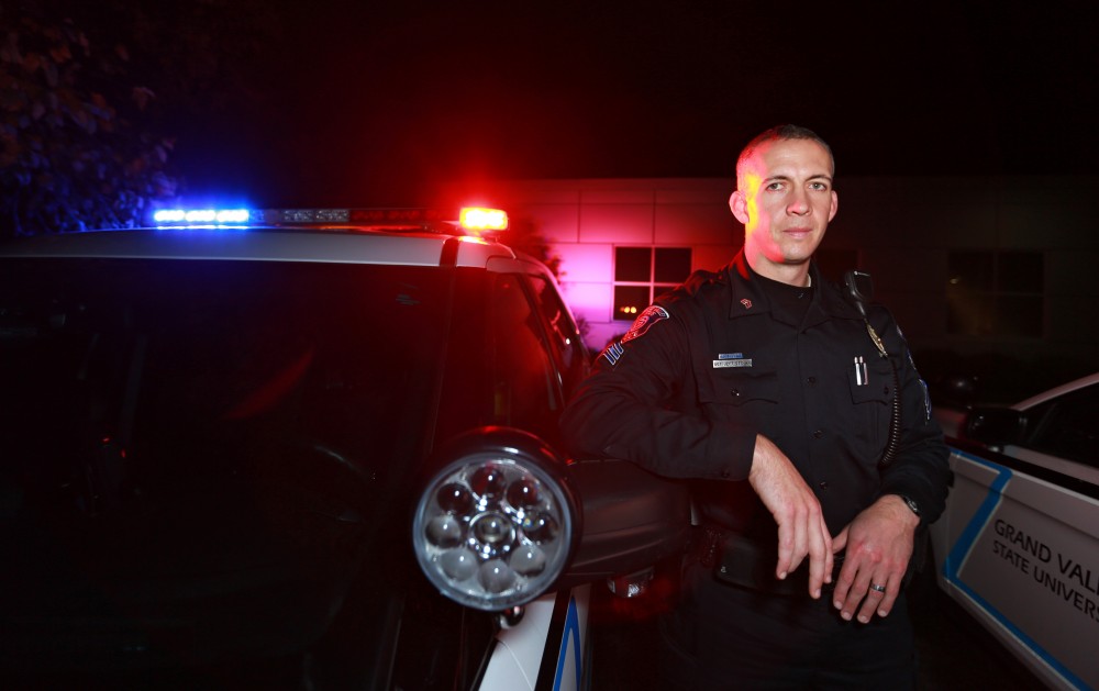 GVL / Kevin Sielaff - Sgt. Jeff Stoll wraps up the night shift and poses in front of his patrol vehicle on Oct. 25.