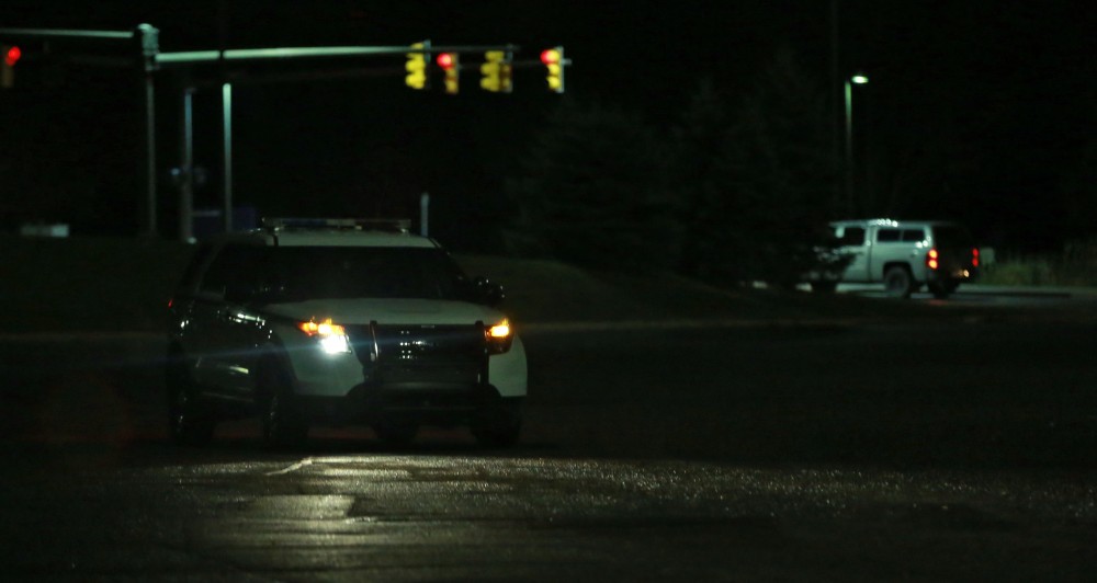 GVL / Kevin Sielaff - Officers scan parking lot G in search of a suspcious male subject on Oct. 25. 