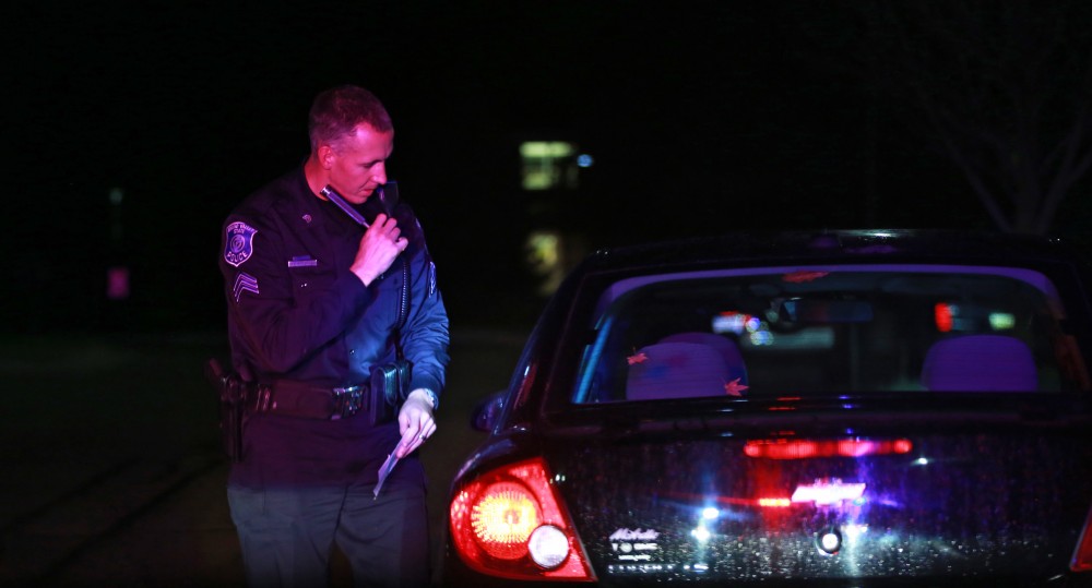 GVL / Kevin Sielaff - Sgt. Jeff Stoll conducts a routine traffic stop near parking lot C on Oct. 25. 