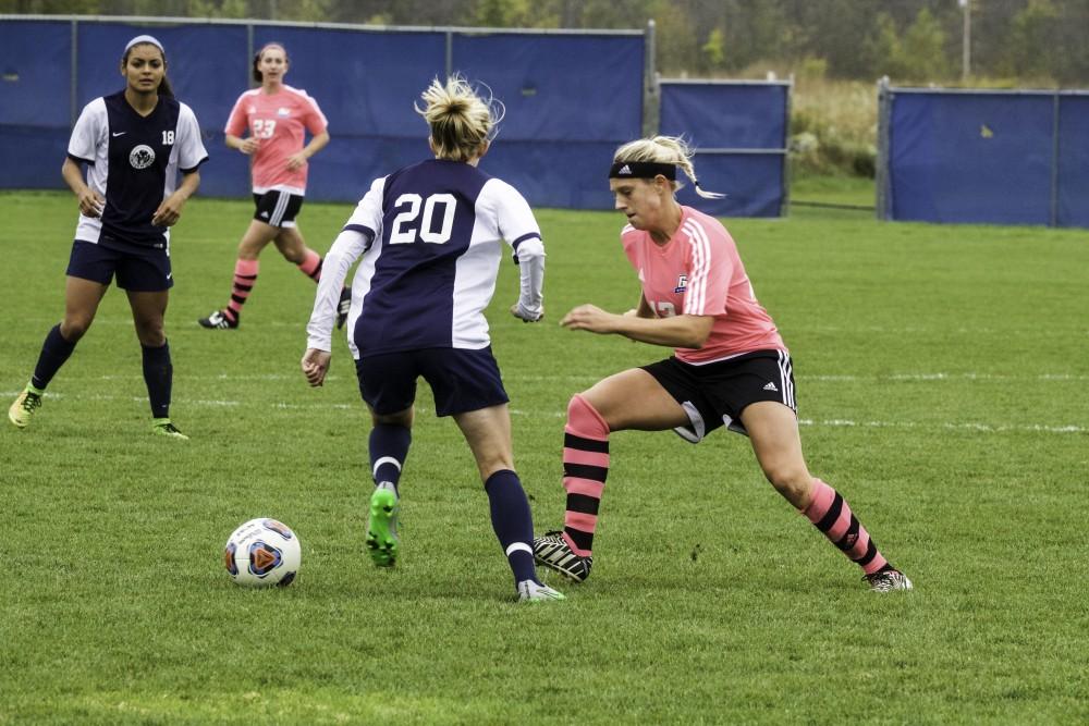 GVL / Sara Carte
Grand Valley’s Women’s Soccer player, Sara Stevens, fight for the ball against Northwood on Oct. 4.