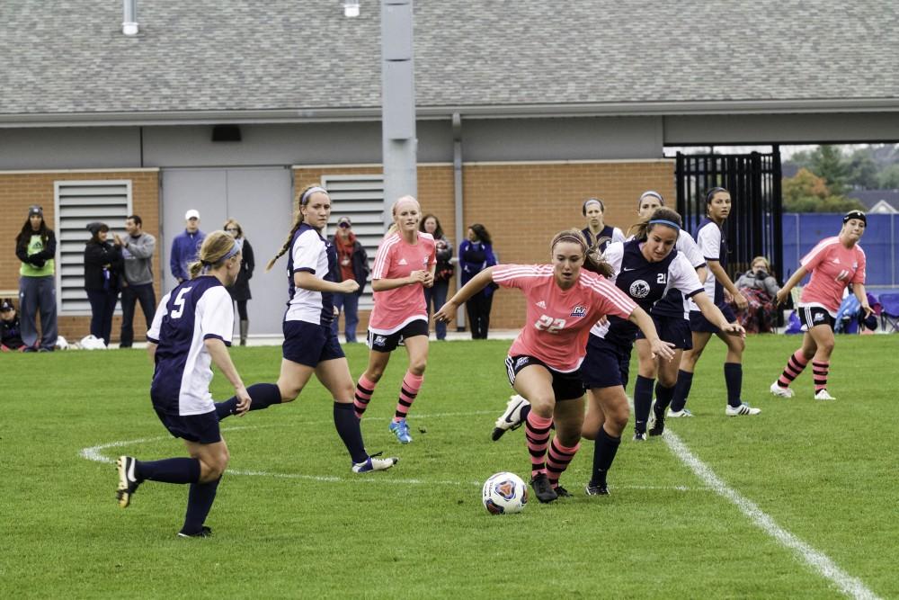 GVL / Sara CarteGrand Valley’s Women’s Soccer player, Samantha Riga, fights for the ball against Nortwood on Oct. 4.