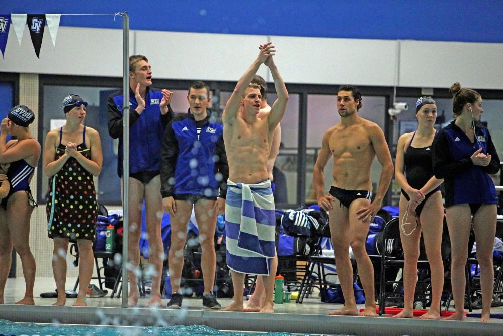 GVL / Emily Frye 
Senior Gianni Ferrero cheers on his teammates during the interclub swim meet on Oct. 10th.