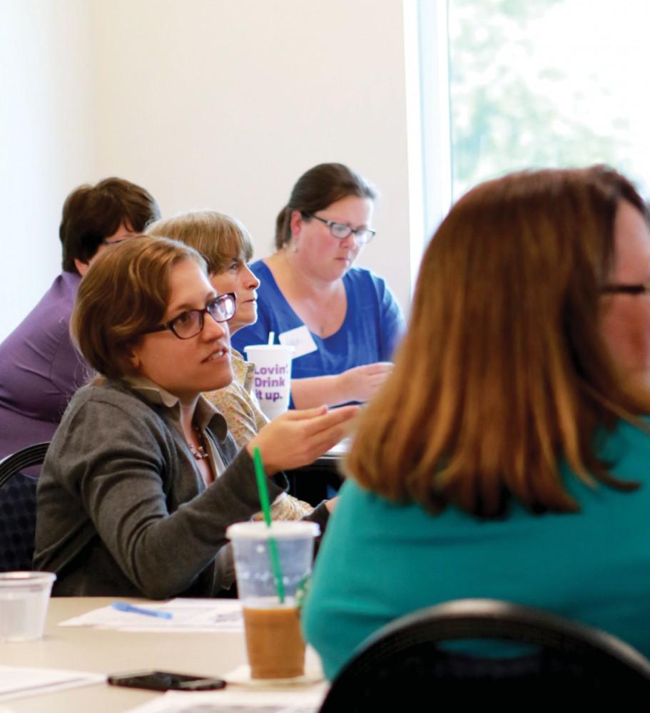 While listening to the excellence series, Susan Kieda, Institutional Marketing staff, gives her input on becoming an ally for transgender students on Oct. 7 in Kirkhoff center in Allendale, MI. The excellence series was open to staff members interested in becoming allies for transgender students.