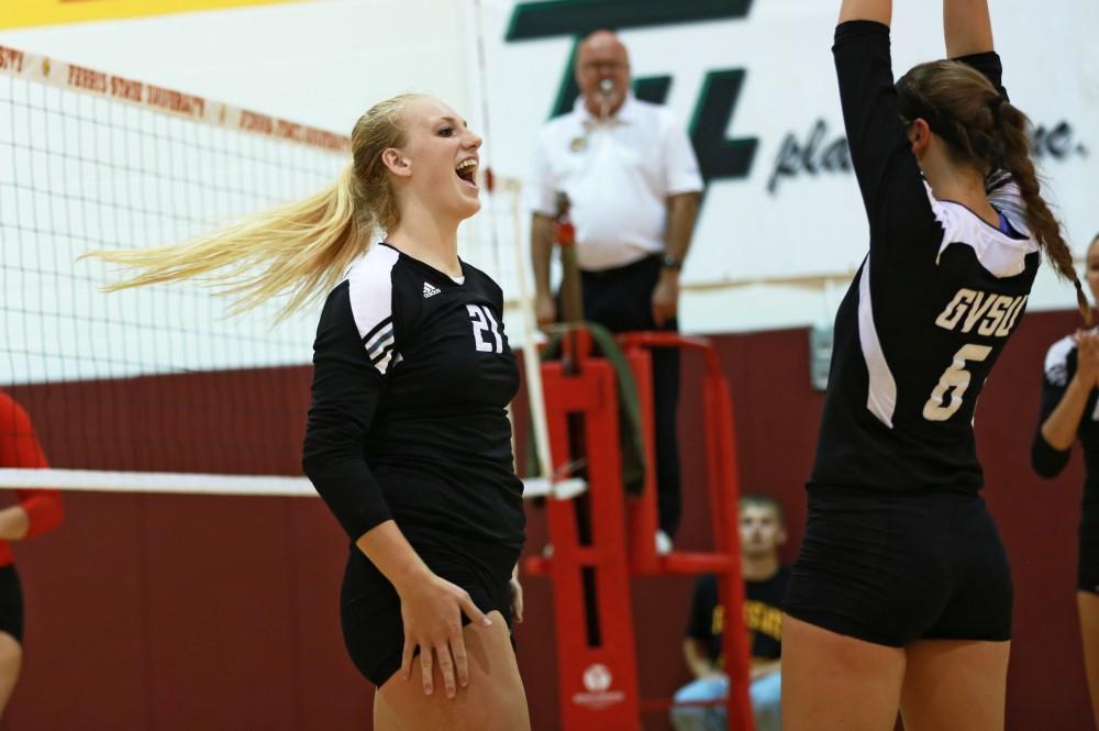 GVL / Kevin Sielaff
Staci Brower (21) celebrates after a point scored. The Lakers fall to the Bulldogs at Ferris State University Sept. 29 by a margin of 3-1. 