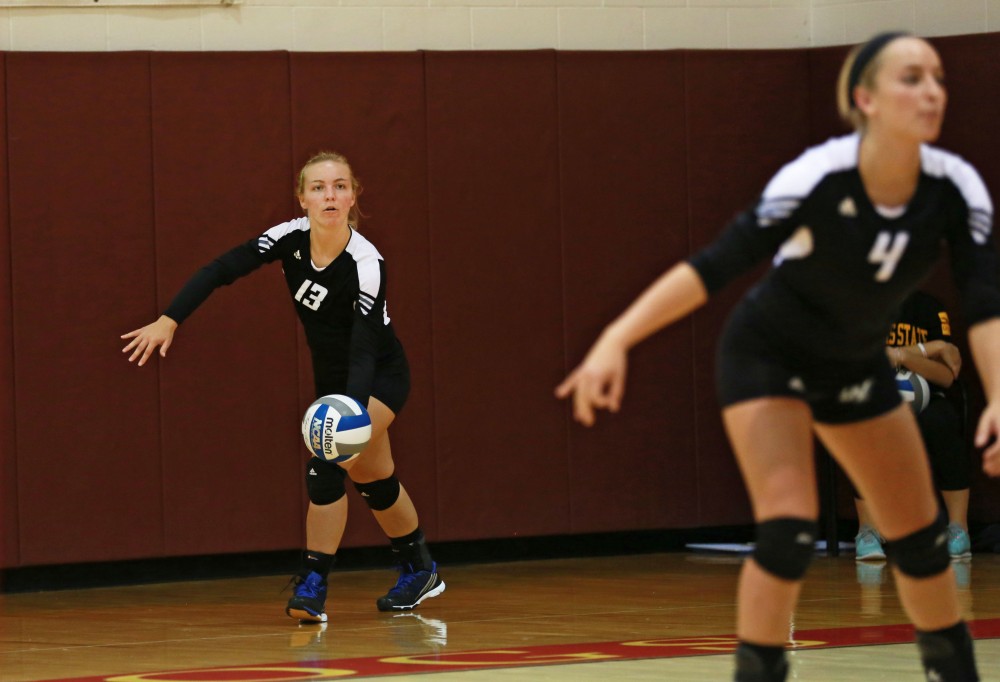 GVL / Kevin Sielaff
Amanda Glaza (13) serves the ball. The Lakers fall to the Bulldogs at Ferris State University Sept. 29 by a margin of 3-1. 