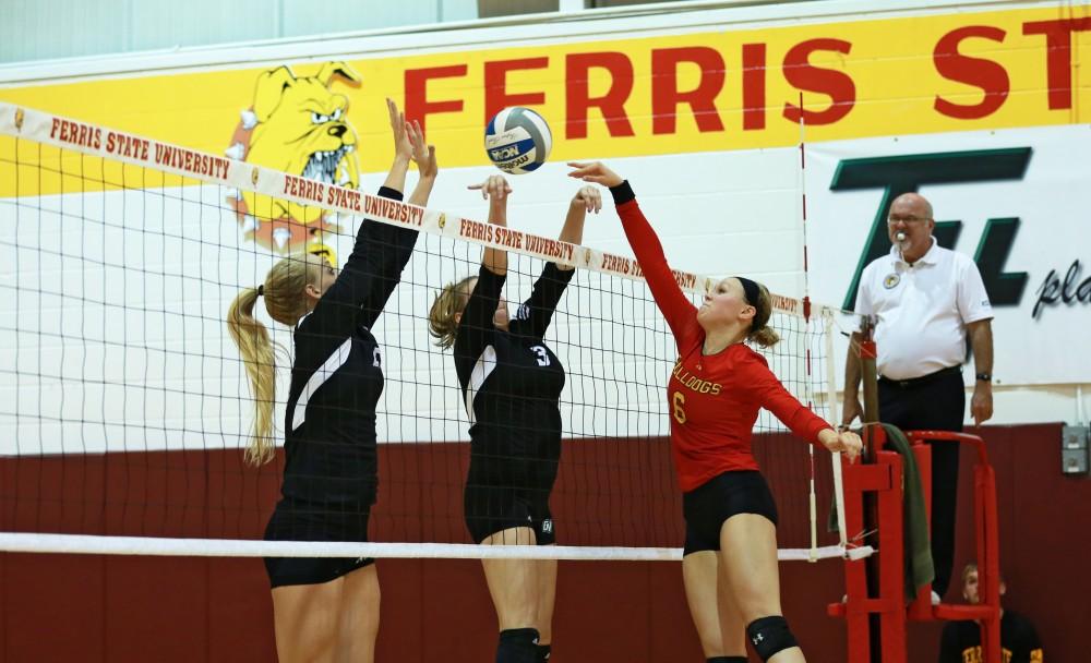 GVL / Kevin Sielaff
Staci Brower (21) and Jessica Majerle (3) go up for a block. The Lakers fall to the Bulldogs at Ferris State University Sept. 29 by a margin of 3-1. 