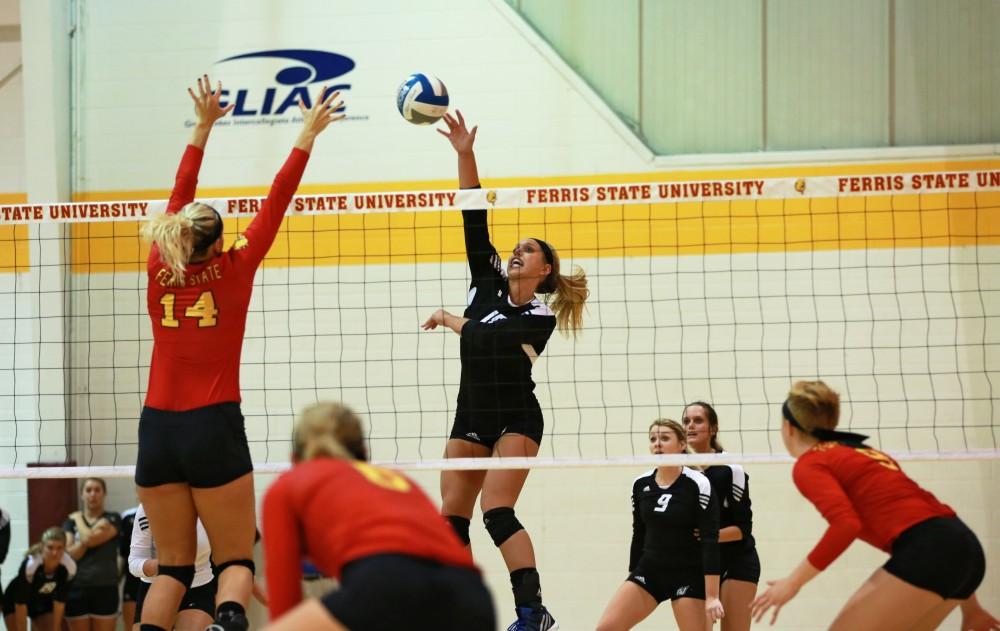 GVL / Kevin Sielaff
Shannon Winicki (18) tips the ball over the net. The Lakers fall to the Bulldogs at Ferris State University Sept. 29 by a margin of 3-1. 