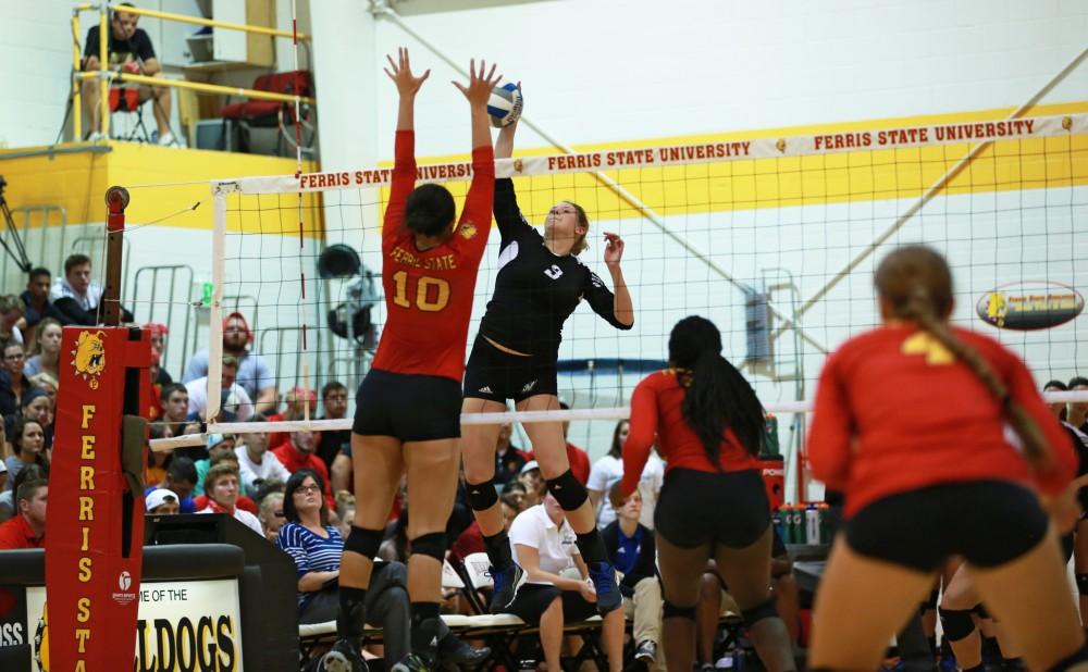 GVL / Kevin Sielaff
Jessica Marjerle (3) attempts to spike the ball past FSU's Alexis Huntey (10). The Lakers fall to the Bulldogs at Ferris State University Sept. 29 by a margin of 3-1. 