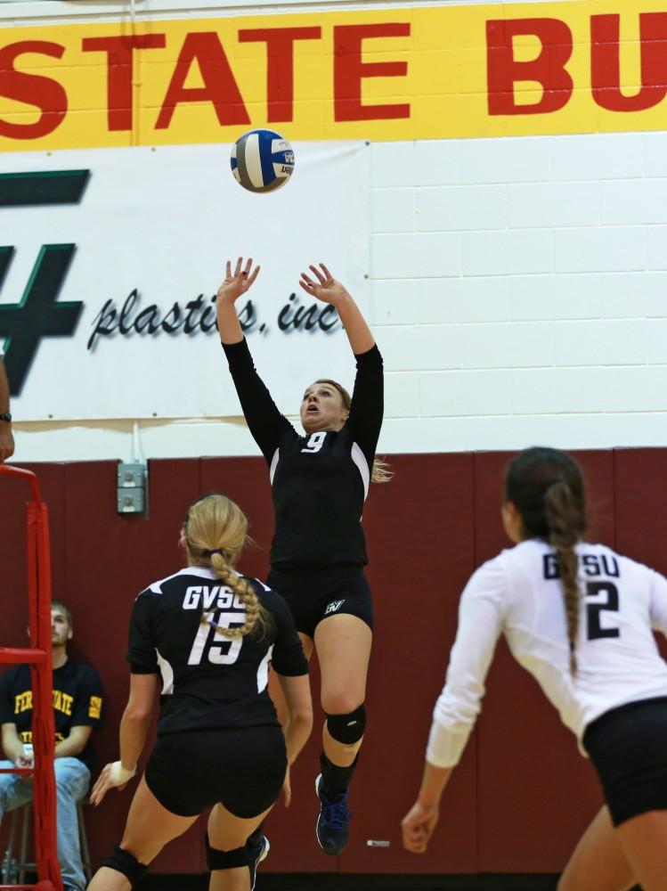 GVL / Kevin Sielaff
Katie Olson (9) sets the ball. The Lakers fall to the Bulldogs at Ferris State University Sept. 29 by a margin of 3-1.