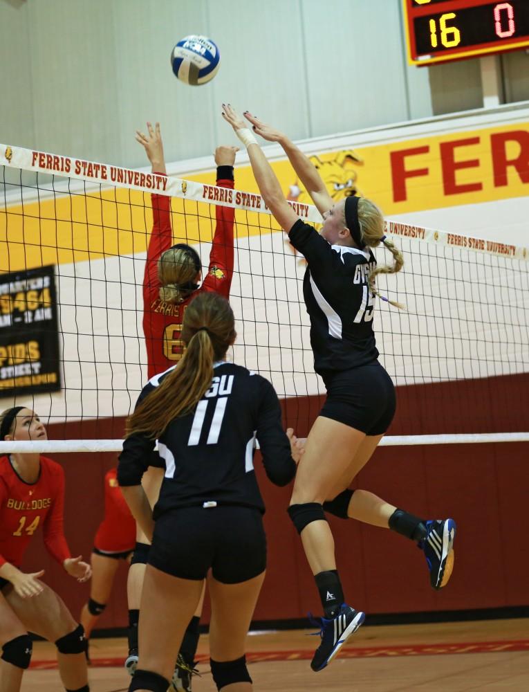 GVL / Kevin Sielaff
Kaleigh Lound (15) tips the ball over the net. The Lakers fall to the Bulldogs at Ferris State University Sept. 29 by a margin of 3-1.